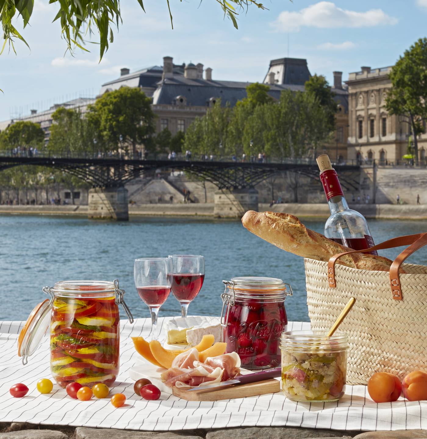A picnic on the bank of the Seine with a Le Parfait Super Jar of ratatouille and cherry tomatoes