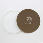 ChouAmi stainless steel flat panel with white silicone gasket ring beside it, top-down on white.