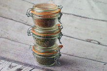 Load image into Gallery viewer, 3-pack of small Le Parfait clip-top jars stacked vertically containing Five Star Kimchi, Perfect Pickles, and Herbes de Provence spice blends.