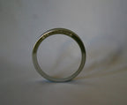 ChouAmi stainless steel ring with 'le petit fermenteur' embossing, side profile view on white.