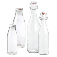 Le Parfait Bottles family hero - two Milk Bottles with white twist-off caps and two Swing Top Bottles with plastic stopper and wire bail.