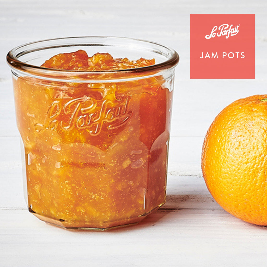 Le Parfait Jam Pot filled with orange marmalade beside a whole orange - 'Jam Pots' branding.