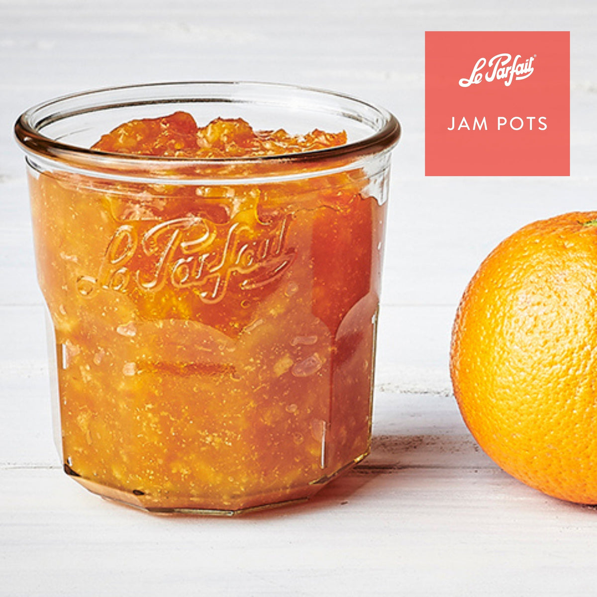 Le Parfait Jam Pot filled with orange marmalade beside a whole orange - 'Jam Pots' branding.