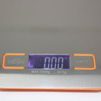 Close-up of the Le Parfait kitchen scale LCD display showing weight in ounces.