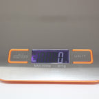 Close-up of the Le Parfait kitchen scale LCD display showing weight in grams.