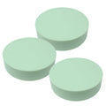 Three mint Le Parfait plastic screw-top jar lids stacked together, embossed logo on top.