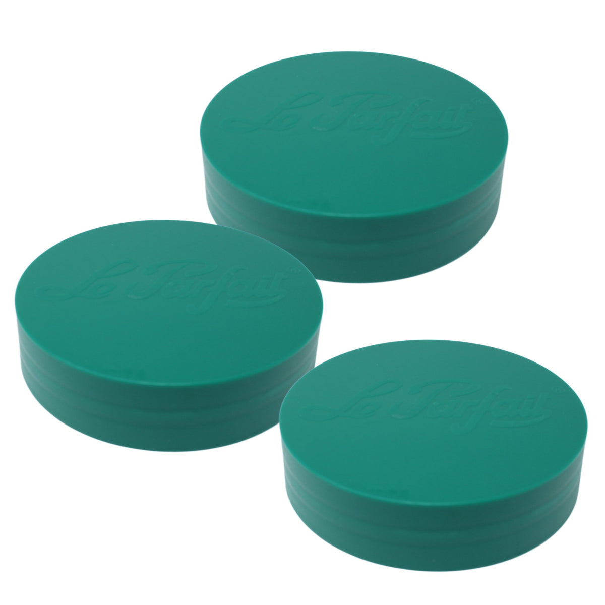 Three pine Le Parfait plastic screw-top jar lids stacked together, embossed logo on top.