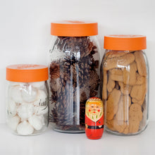 Load image into Gallery viewer, Le Parfait Screw Top Jars with orange lids holding white meringues, pinecones, and gingerbread cookies beside a hand-painted Russian Santa figurine.