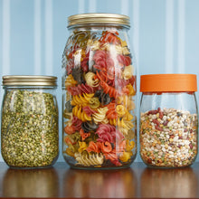 Load image into Gallery viewer, Le Parfait Screw Top Jars in a pantry display - gold metal-lid split peas, gold metal-lid multicolor pasta, and orange-lid mixed beans.