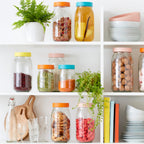 Rows of authentic French glass storage jars on shelves.
