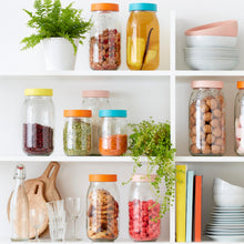 Load image into Gallery viewer, Open kitchen shelves of Le Parfait Screw Top Jars in mixed-color lids filled with granola, infused water, beans, walnuts, meringues, and cookies.