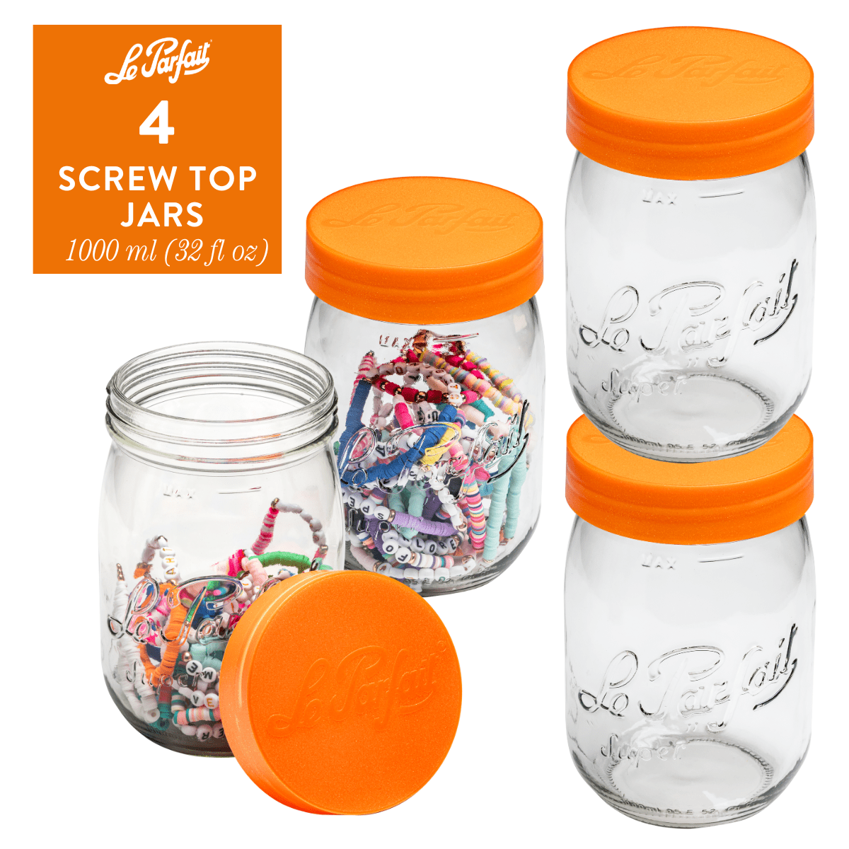 4-pack of Le Parfait Screw Top Jars 1L (32 fl oz) with orange plastic screw lids - one jar styled with assorted wrapped gift candies.