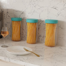 Load image into Gallery viewer, Three Le Parfait Screw Top Jars with teal lids filled with spaghetti on a marble countertop beside a wine glass and white plate.