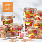 Le Parfait Super Terrines family hero in multiple sizes filled with caprese-style tomato, mozzarella, and basil preserves with handwritten gift tags.