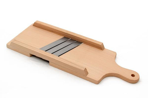 Le Parfait Cabbage Shredder, beechwood mandoline with three steel blades, angled view on white background.