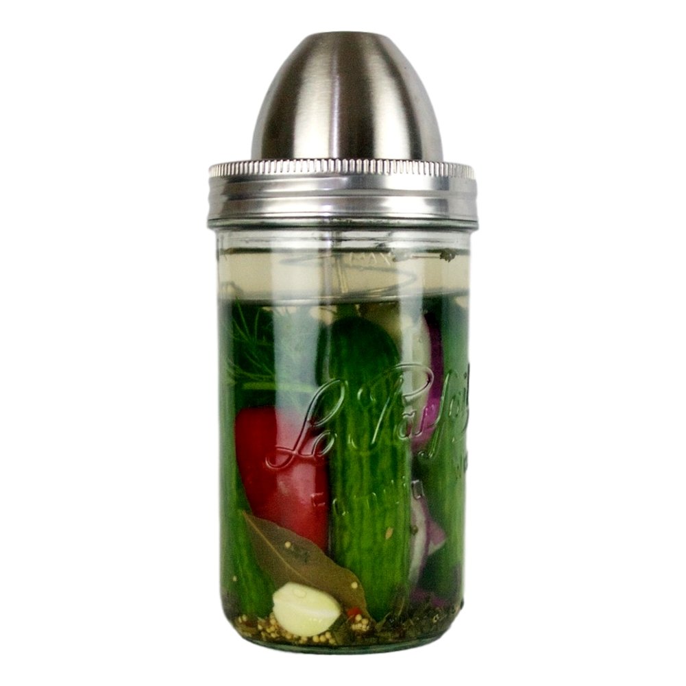 ChouAmi Solo stainless steel fermentation device installed on a Le Parfait Familia Wiss jar fermenting cucumbers, garlic, bay leaf, and chili.