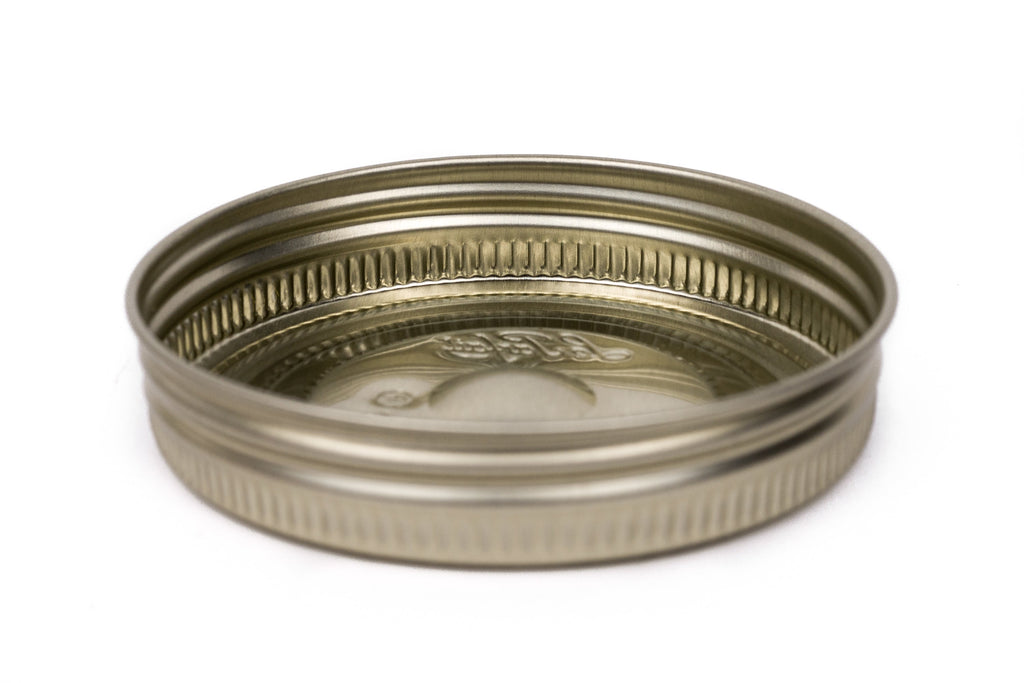 Single gold Le Parfait Familia Wiss metal screw lid in 110mm size - side profile on white.