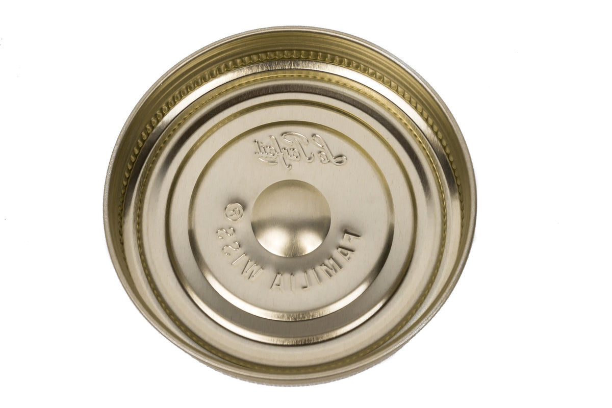 Inside view of a gold Le Parfait Familia Wiss metal screw lid showing the threaded ring.