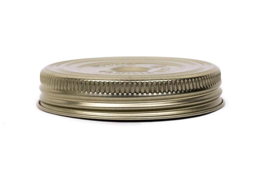Single gold Le Parfait Familia Wiss metal screw lid in 82mm size - side profile on white.