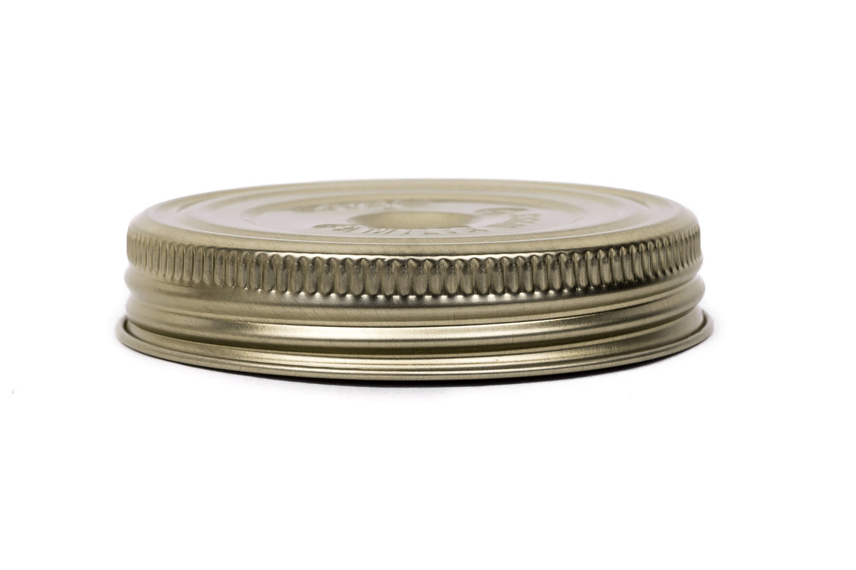 Single gold Le Parfait Familia Wiss metal screw lid in 82mm size - side profile on white.