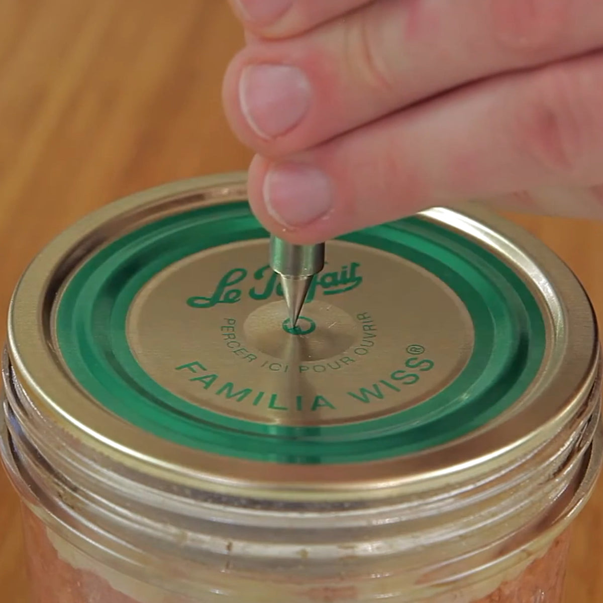 Le Parfait jar opener being used to open a sealer jar.