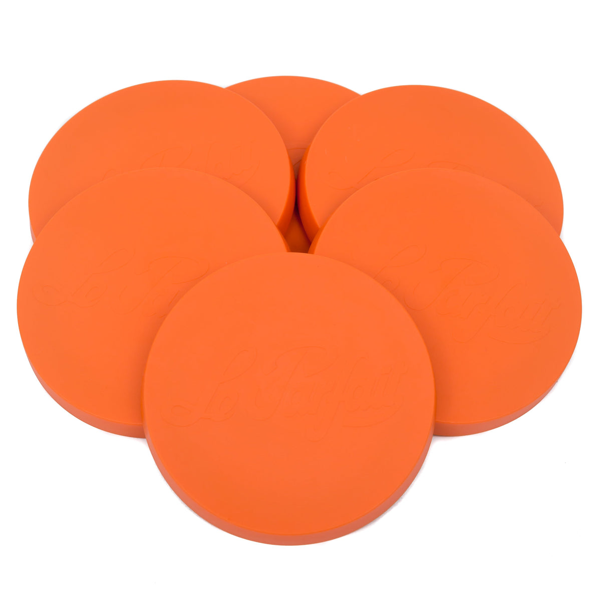 Six orange Le Parfait Super Snap Cover Lids stacked in a pyramid cluster on white.