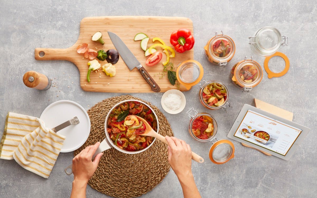 Preparing vegetables in Le Parfait Super Jars at a kitchen table